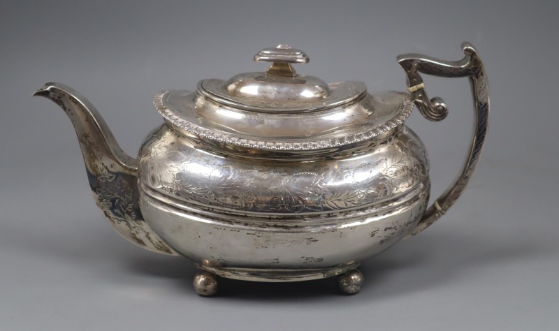 A George III engraved silver teapot, with engraved inscription, James McKay, Edinburgh, 1814, gross 22 oz.